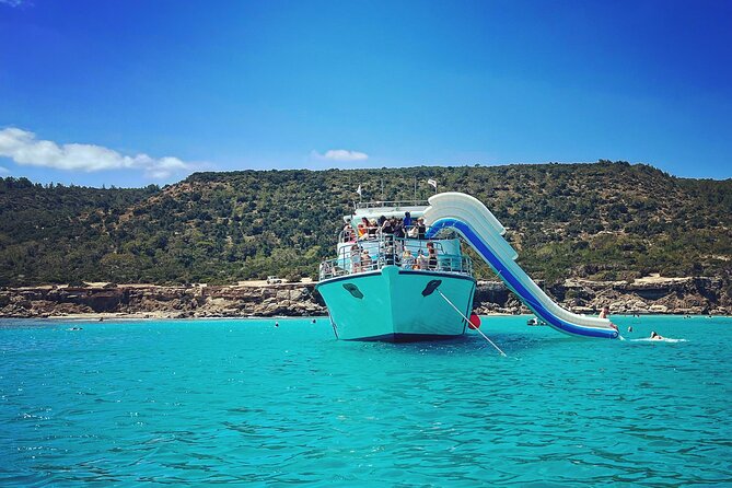 Blue Lagoon cruise: giant slide, music & Paphos hotel transfers - The Blue Lagoon is the star of the day